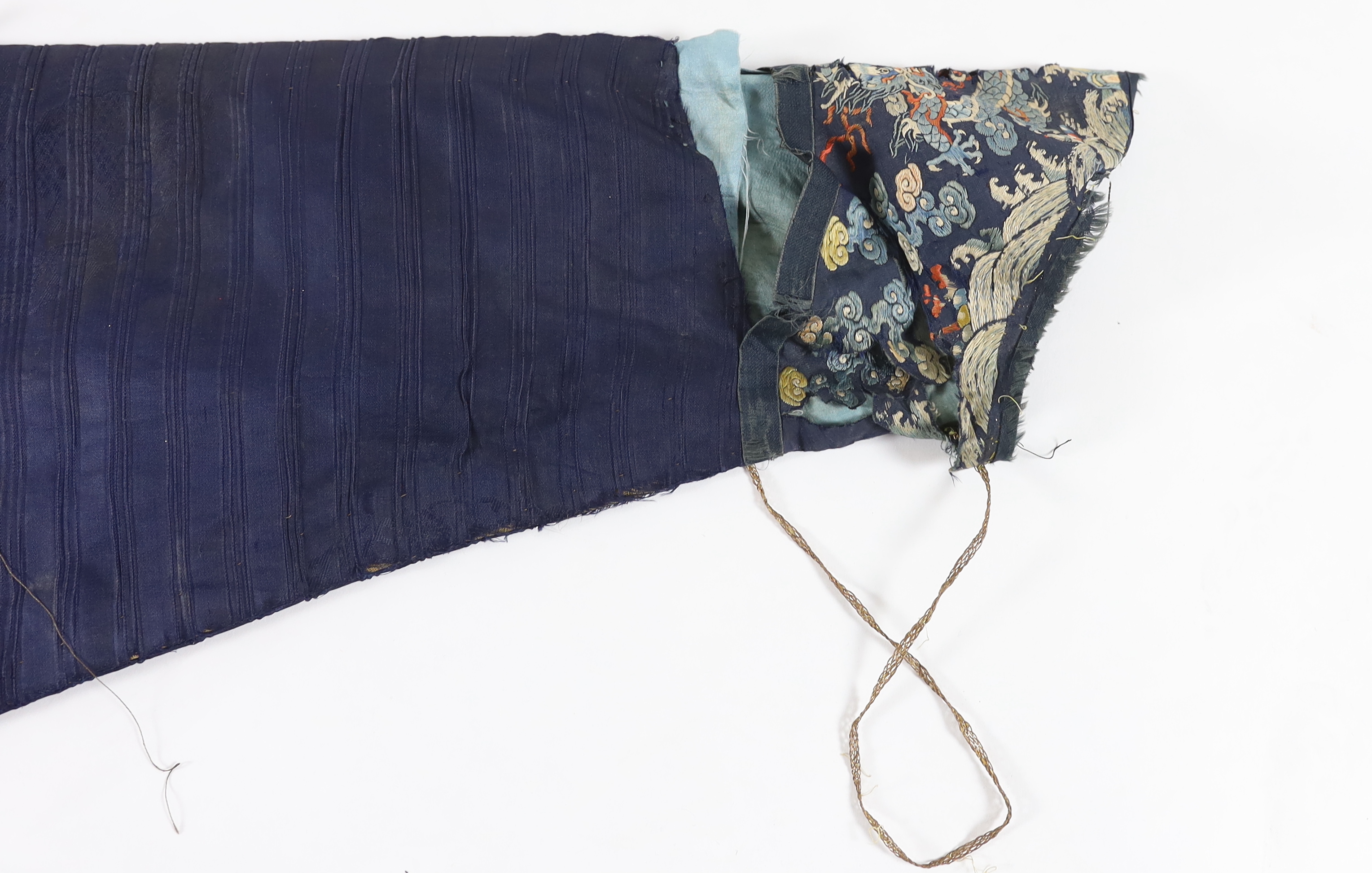 A Chinese chestnut-ground ‘nine dragon’ robe, jifu, 19th century, tears and losses